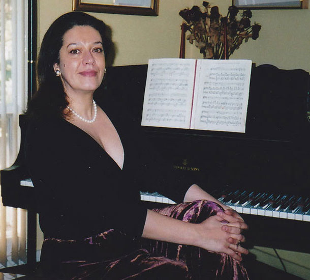 Georgiana Rosca sitting at her piano